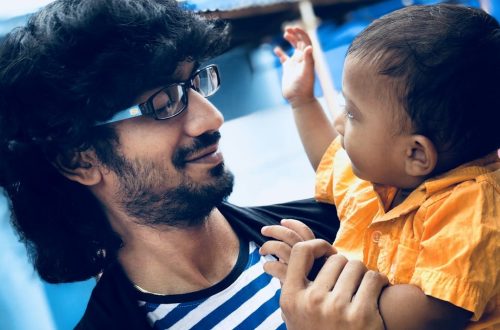 Dad and son - Father holding his baby son in his hand